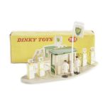 A Dinky Toys 783 Petrol Pump Station ‘BP’, comprising sign, kiosk, four pumps and 007 plastic petrol