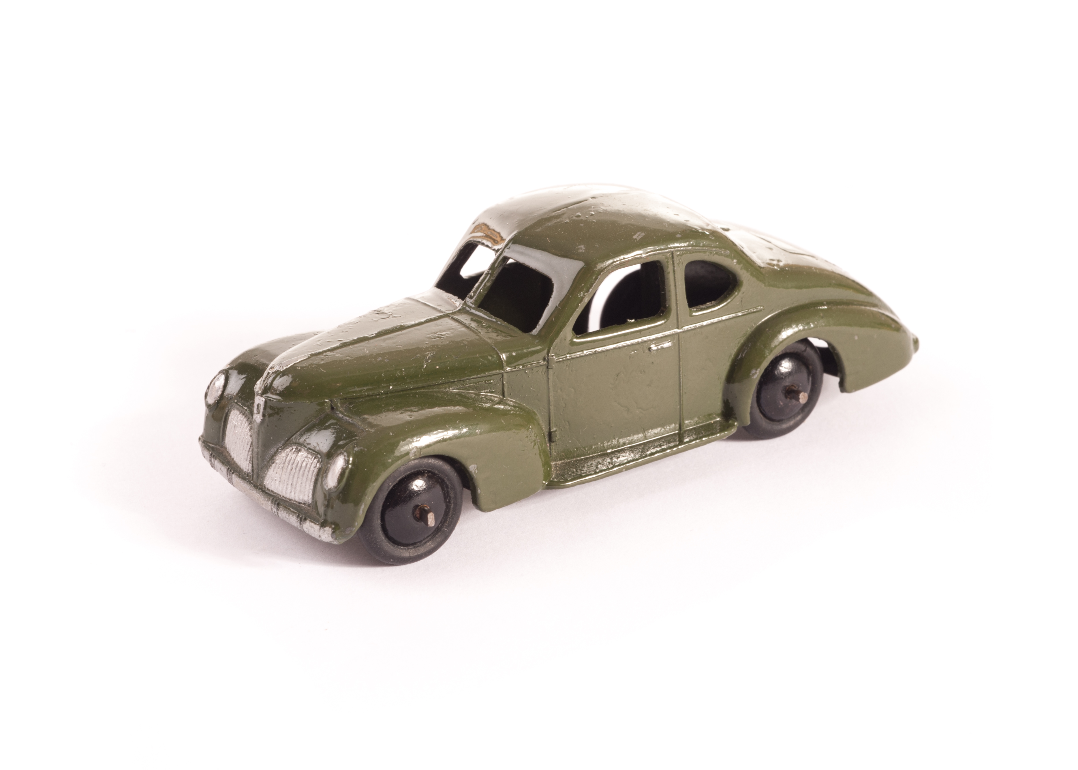 A Dinky Toys 39f Studebaker State Commander, moss green body, black smooth hubs, lacquered