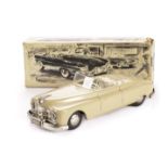 An Arnold US Zone 4500 Tinplate Friction Drive Cadillac, in light tan with cream and green seats