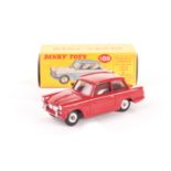 A Rare Dinky Toys Promotional 189 Triumph Herald, in Signal red with spun hubs and no interior, in