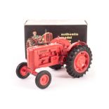 A Pippin Toys Nuffield Tractor, in red plastic, in original box with top and bottom inserts, E,