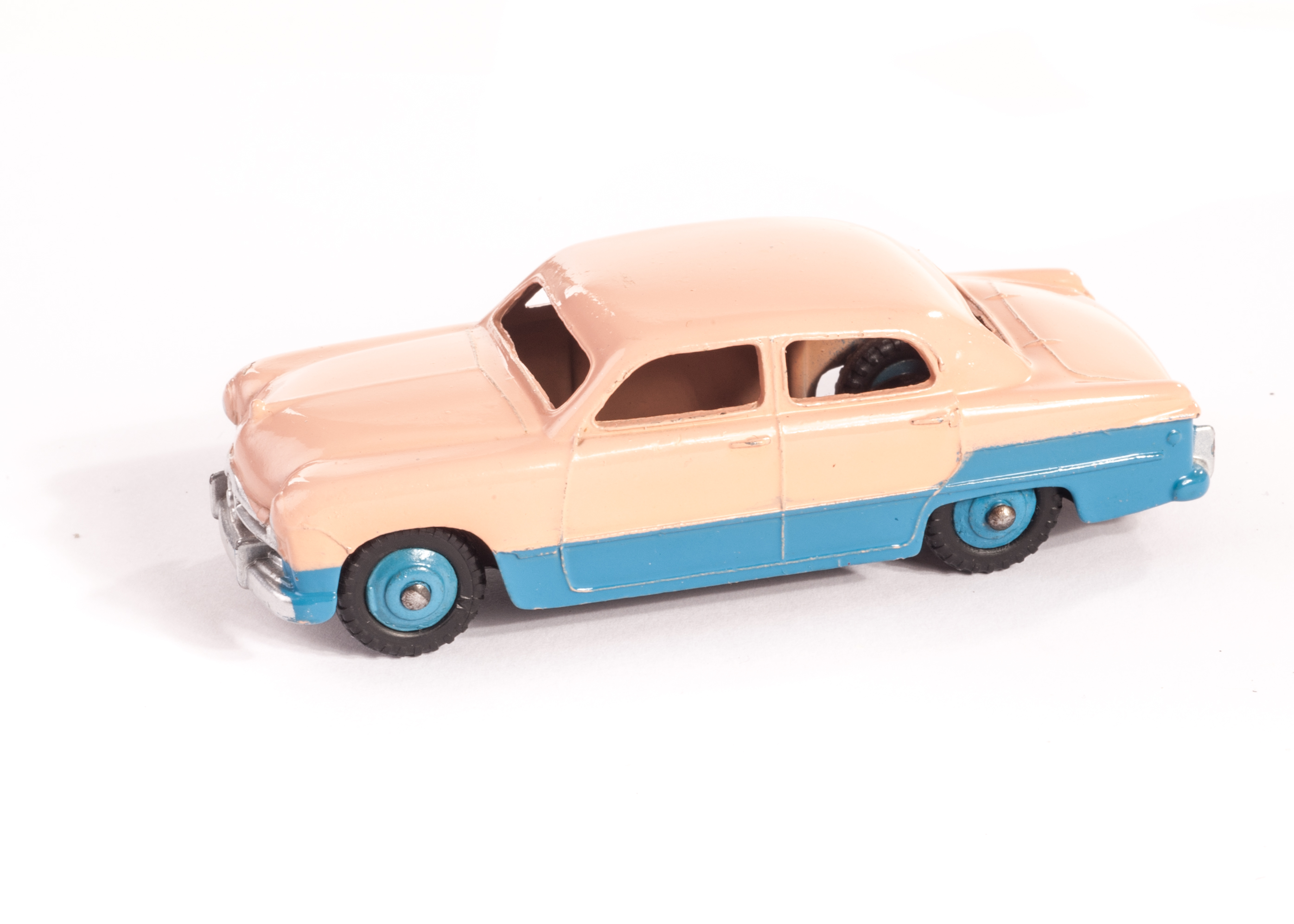 A Dinky Toys 170 Ford Fordor Sedan, lowline, blue lower body, pink upper body, blue ridged hubs, M