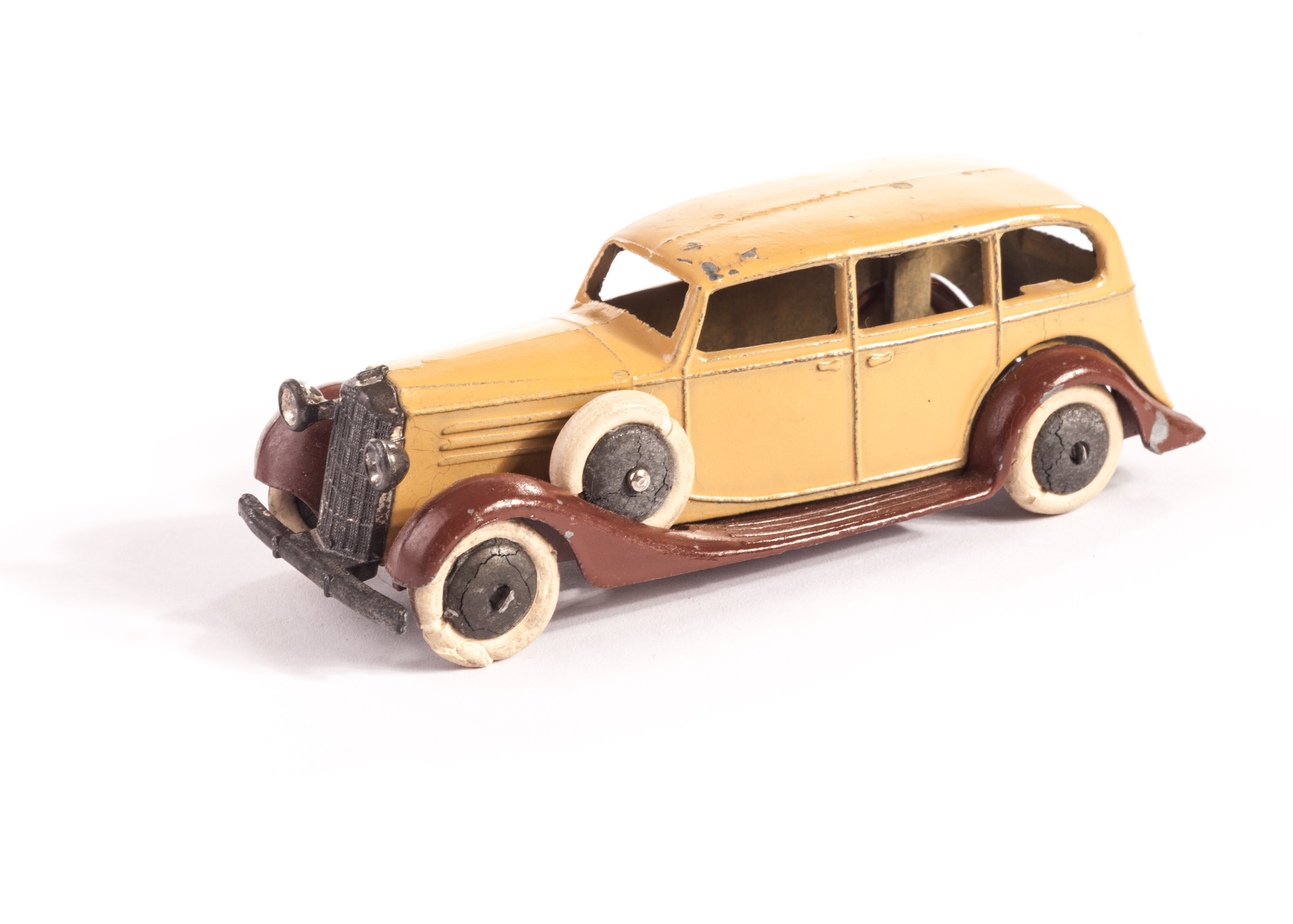 A Pre-War Dinky Toys 30d Vauxhall, brown open chassis, tan body, egg box grille, smooth unpainted