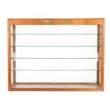 A Dinky Toys Front Loading Wooden Display Cabinet, wooden framed glass display case with four