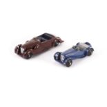 A Dinky Toys 38f Jaguar SS100, dark blue body, grey interior, black ridged hubs, silver edged