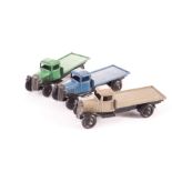 Dinky Toys 25c Flat Truck, three examples, all type 3 closed chassis, green body, blue body, stone