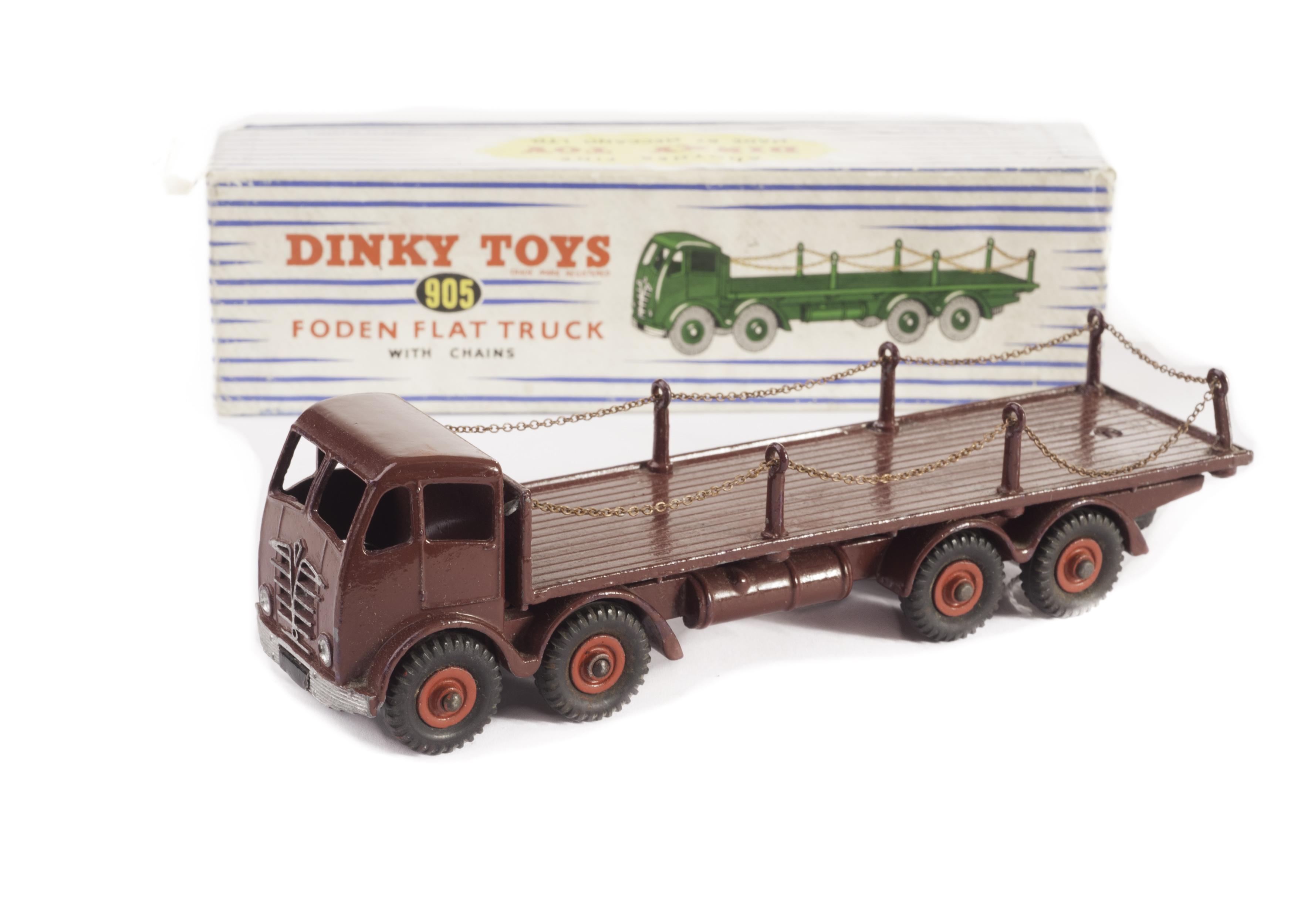 A Dinky Toys 905 Foden Flat Truck with Chains, in maroon with red hubs, in original blue striped box