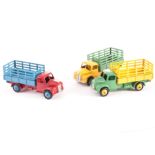 Dinky Toys 30n/343 Farm Produce Wagon, three examples, 343 green cab and chassis, yellow back and