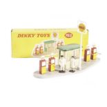 A Dinky Toys 782 Petrol Pump Station ‘Shell’, comprising sign, kiosk, four pumps and 007 plastic