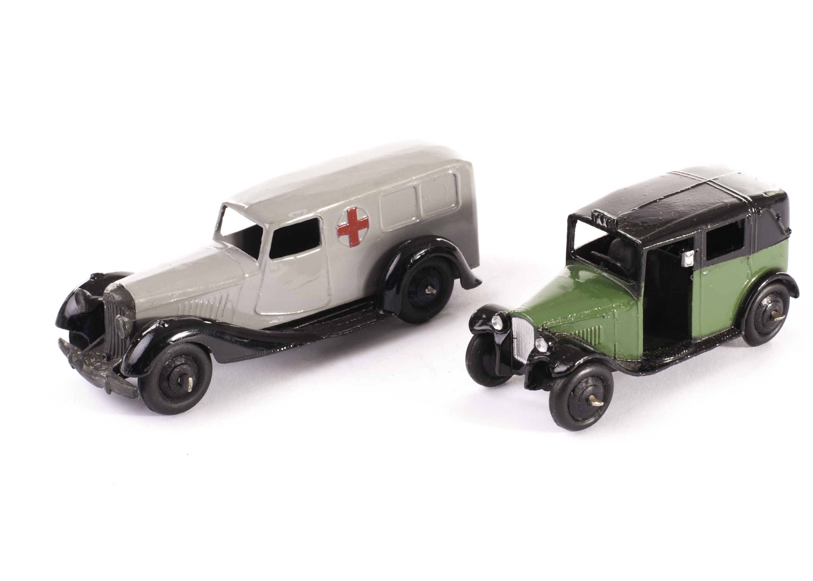 A Dinky Toys 30f Ambulance, grey body, black moulded chassis, black ridged hubs, 36g Taxi with