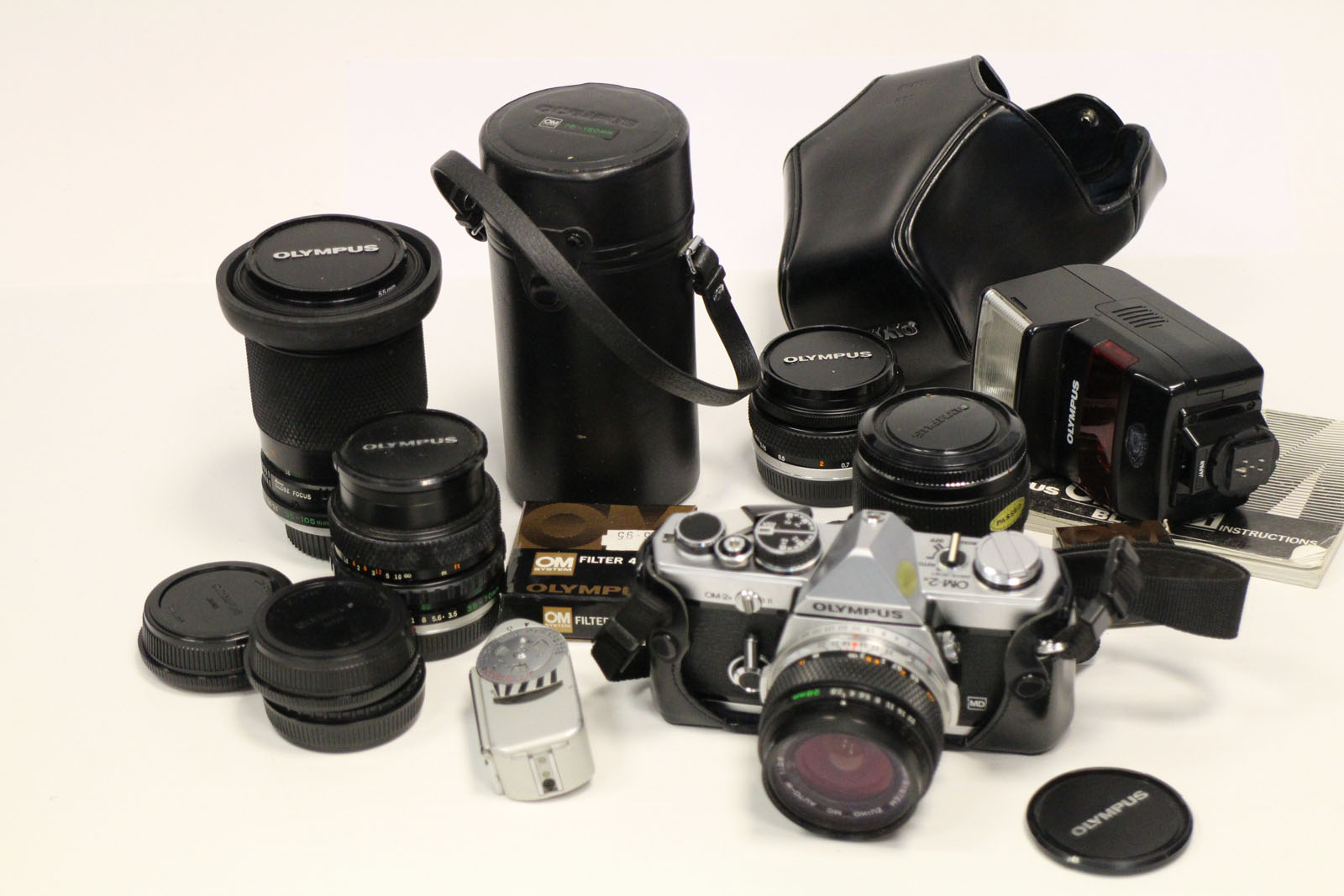 Olympus OM2 with Lenses: chrome body with 5 Zuiko lenses and accessories (a lot)