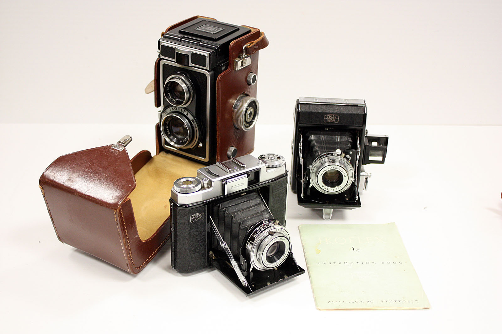 Zeiss Cameras: an Ikoflex 1c with original instruction book in maker's case and two other Zeiss