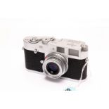 A Leica M1 Rangefinder Camera, chrome, serial no. 1085240, with Leitz Elmar f/2.8 50mm lens, with