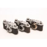 Leica Rangefinder Cameras: thee Leica cameras, serial nos. 270851 / 281894 / 392479, each with Leitz