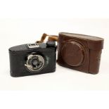 A Baby Minolta Bakelite Camera, with Nippon lens, in maker's case