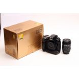 A Nikon D2X Digital SLR Camera, in maker's box, together with AF Nikkor f/3.5-4.5 28-85mm lens