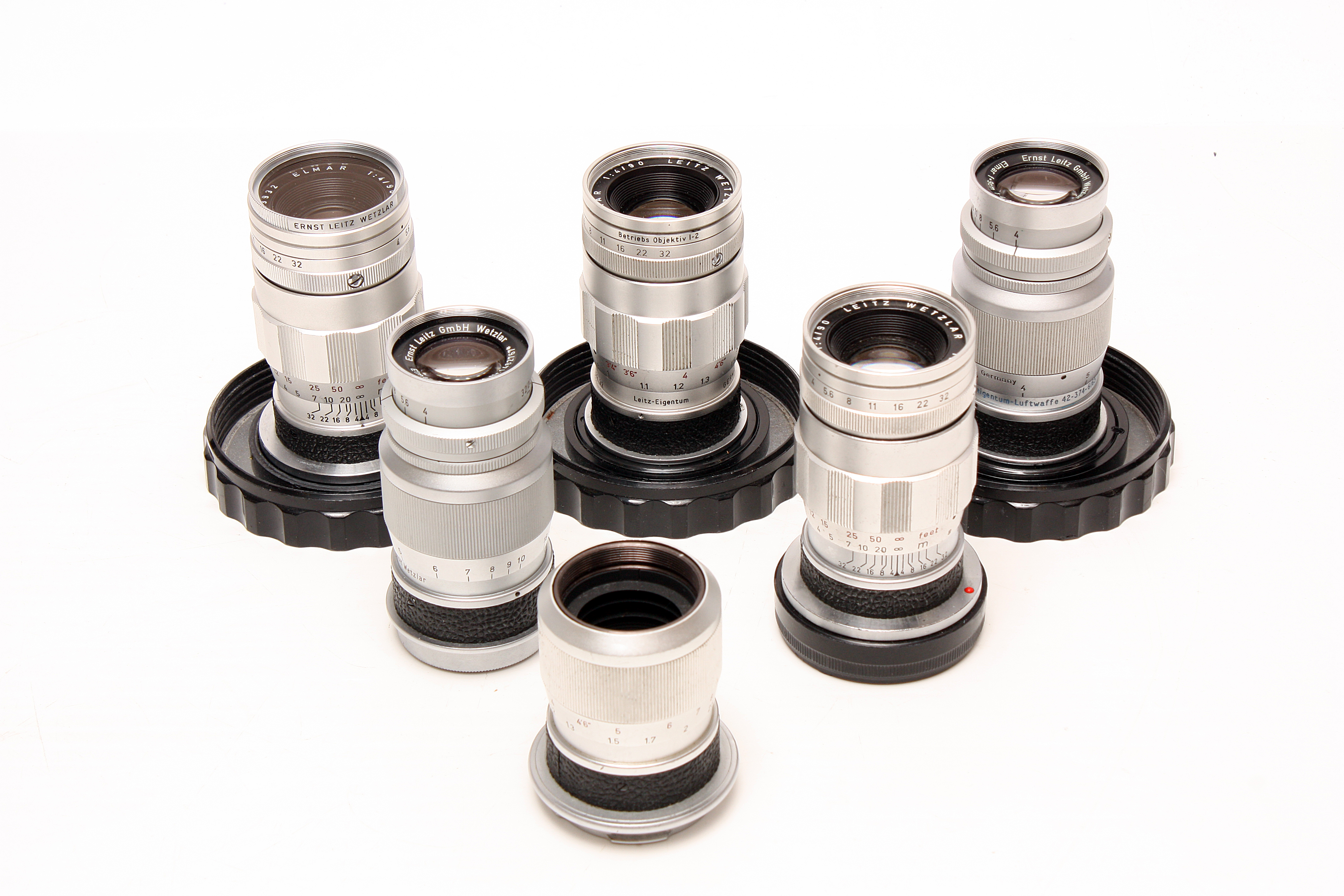 Various Leitz Lenses: quantity of five Leitz f/4 90mm lenses, all with various engravings
