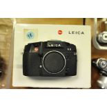 A Leica R8 SLR Body, black, serial no. 2428169, with various engravings including 'Leitz-Eigentum'