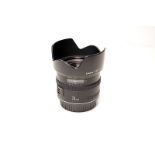 A Canon EF f/2.8 24mm Lens, with Canon EW-60 lens hood and caps