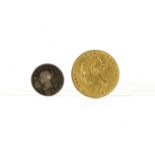 A Victorian gold Sovereign coin, dated 1871 with young head and shield back, F, together with a