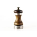 A modern silver banded mahogany pepper mill,  of shaped design with silver band to rim and base,
