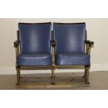 A pair of Art Deco cinema chairs,  the blue upholstered hinged seats and curved backs supported on