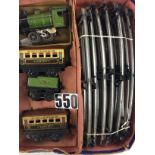 A Hornby O Gauge early M1 clockwork train: including green fixed-key locomotive and tender 2728, two