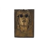 The Beatles / John Lennon: A plaster wall plague of Johns face, signed J Somerville, approx 15"