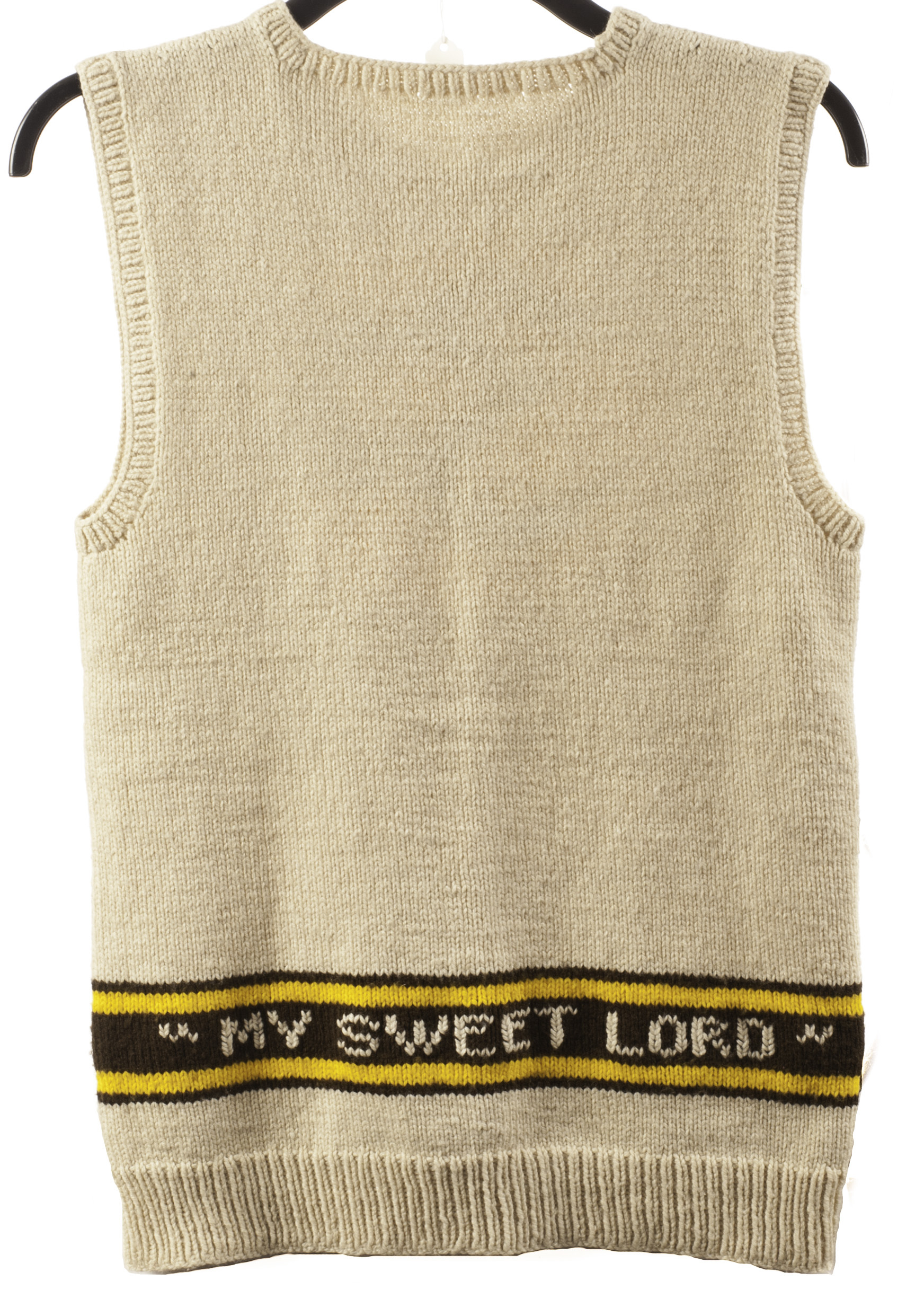 The Beatles / George Harrison: A hand knitted sleeveless jumper with 'OM' logo, this jumper the - Image 2 of 2