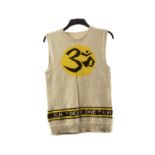 The Beatles / George Harrison: A hand knitted sleeveless jumper with 'OM' logo, this jumper the