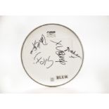 Blur: An autographed drumhead by Damon Albarn, Graham Coxon, Alex James and Dave Rowntree, (10 ½”