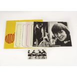 The Monkees: 1967 fan club folder containing four black and white photos and biography sheet of each