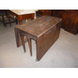 A Georgian mahogany long drop lead dining table, AF