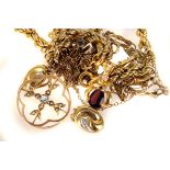 An assortment of 9ct gold and yellow metal jewellery, comprising a rope chain, gem set pendants, a