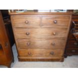 A Victorian mahogany chest of two over three drawers, with rounded corners and knob handles,