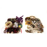 A group of costume jewellery items, comprising many bead necklaces, bangles, bracelets and more (2