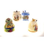 A group of four jam/preserve pots, including one in the form of a windmill, one florally decorated