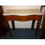 A Victorian mahogany marble top consul table, of serpentine form with single frieze drawer