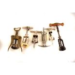 A small collection of vintage and modern cloche corkscrews, including a 19th century example (