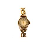 A 9ct gold lady's Longines wristwatch, having baton numerals, on linked bracelet