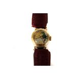 A 9ct gold lady's wristwatch, missing dial, with perpetual movement, on maroon leather strap