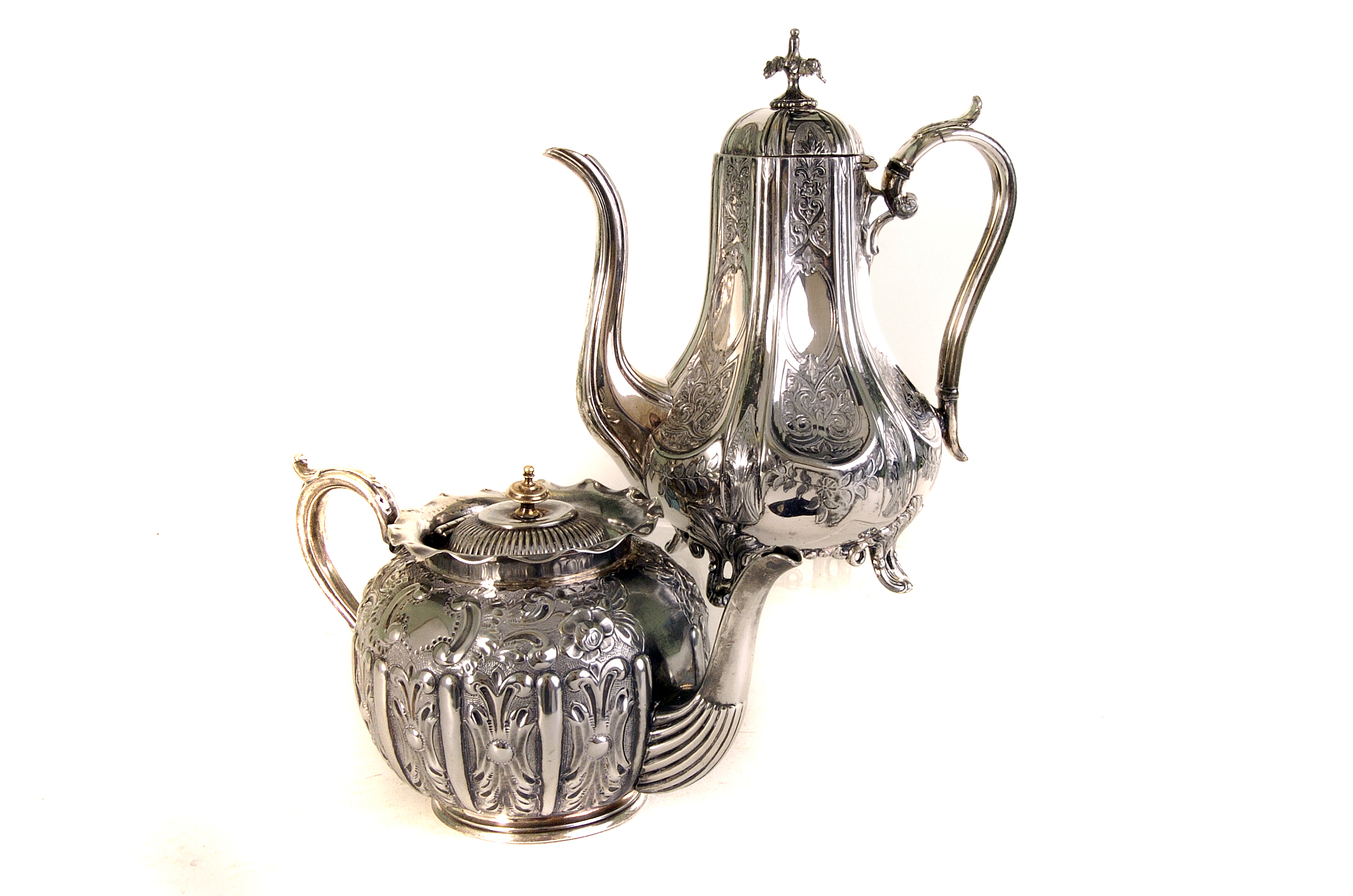 A quantity of silver plate and flatware, including an engraved coffee pot, a repousse tea pot, and a