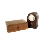 A walnut writing slope, together with a mahogany mantle clock with eight day movement (2)