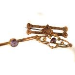 Three 9ct gold brooches, each having different designs with gem set decoration, approx 5g