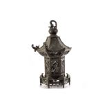 A Chinese spelter lamp base in the form of a Pagoda, having pierced dragon and swag design to the