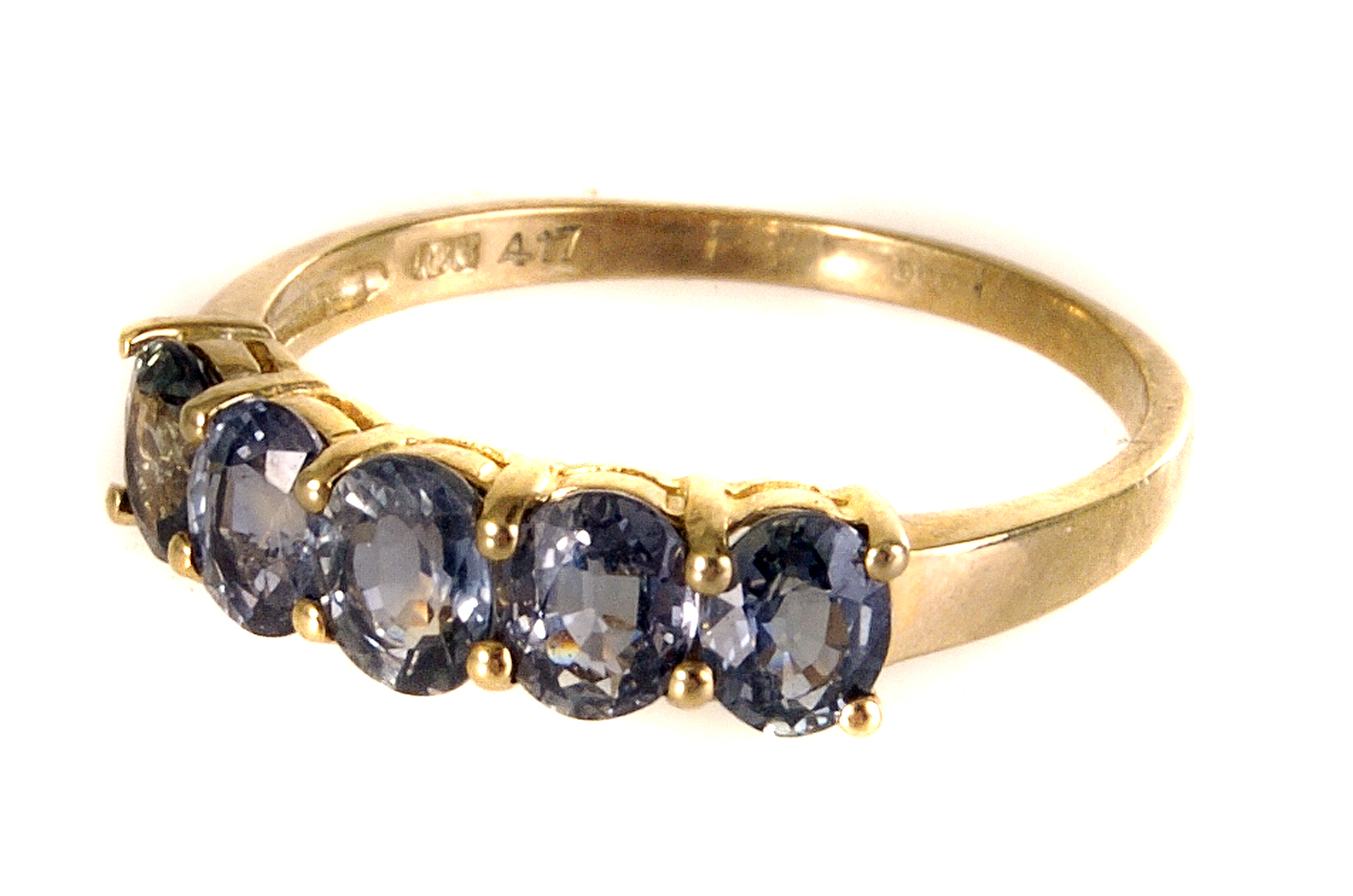 A 9ct gold five stone dress ring, the five oval cut stones of either tourmaline or bi-colour