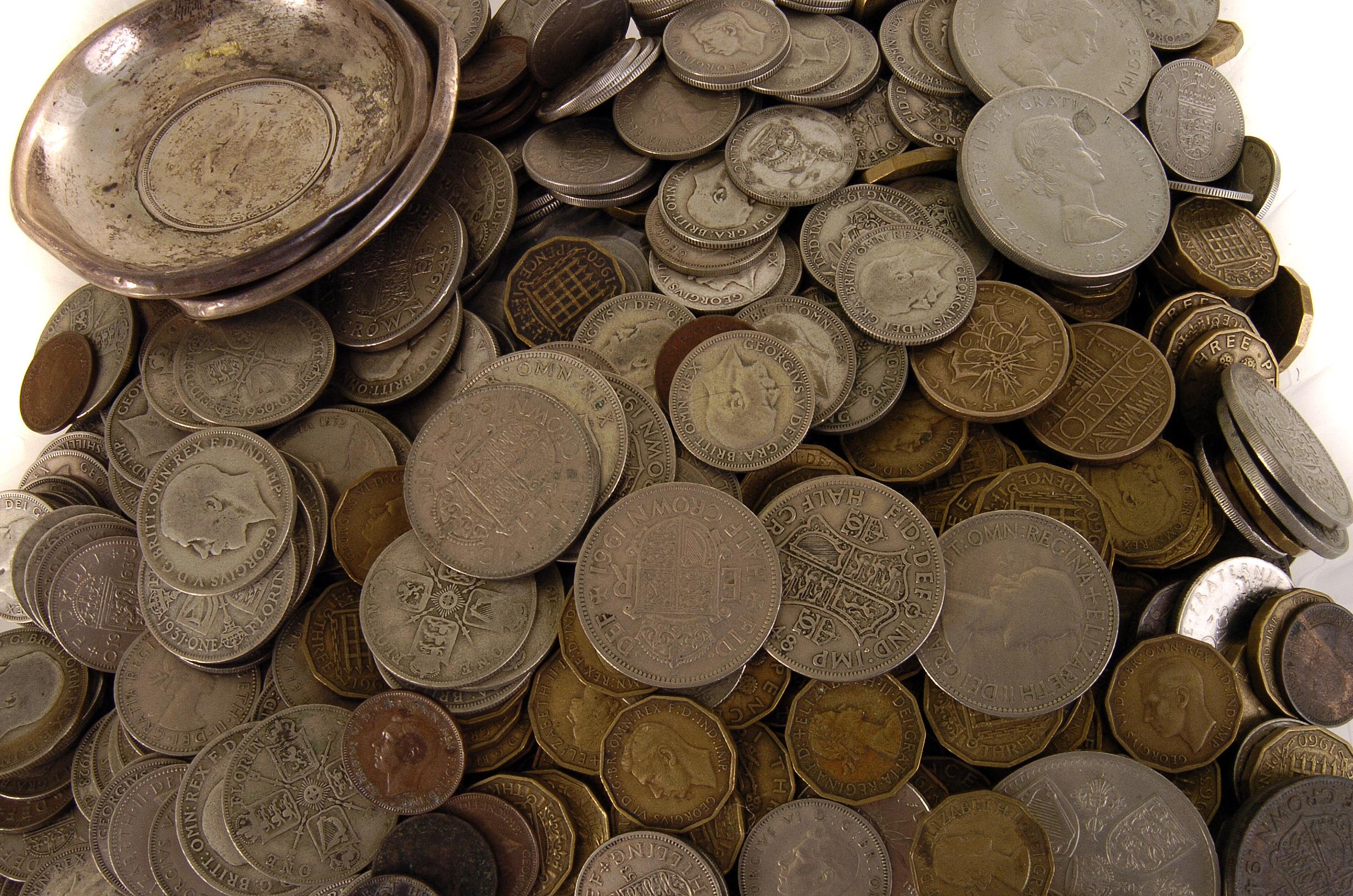 A large collection of British coinage, including some pre-1946 examples, plus two white metal coin