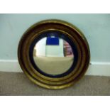 A circular gilt framed Captain's mirror, having central convex mirror, in deep frame