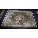 A modern Kashmir silk carpet, having light green ground border and central panel with pink and