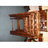 A nest of four 1920s Chinese rosewood tables, with bamboo effect rails and styles, and leaf and